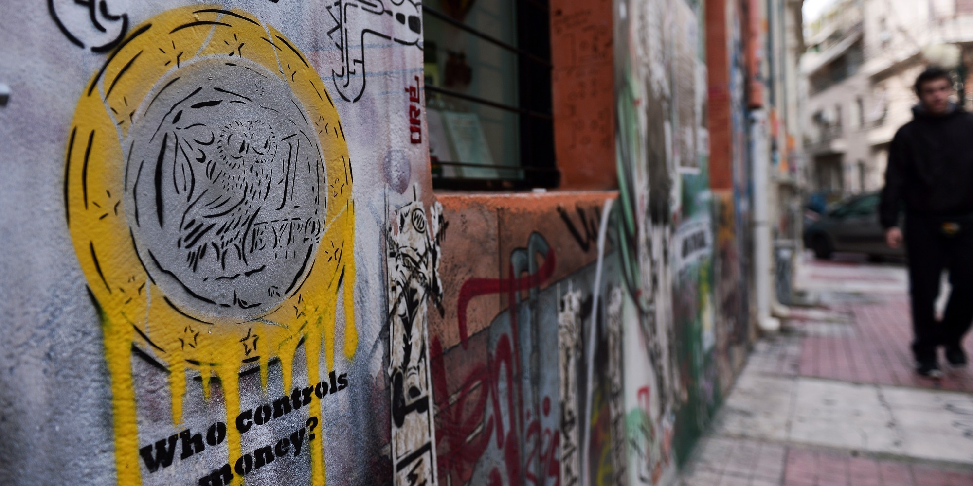 A graffiti in the center of Athens, depicting a Greek euro coin, is seen on February 4, 2015. Greek Finance Minister Yanis Varoufakis told Italian newspaper Il Messaggero in an interview published on February 4 that Athens needed up to six weeks to draw up a global economic plan, as it lobbies its European allies to win backing for debt relief proposals.                        AFP PHOTO/ LOUISA GOULIAMAKI        (Photo credit should read LOUISA GOULIAMAKI/AFP/Getty Images)